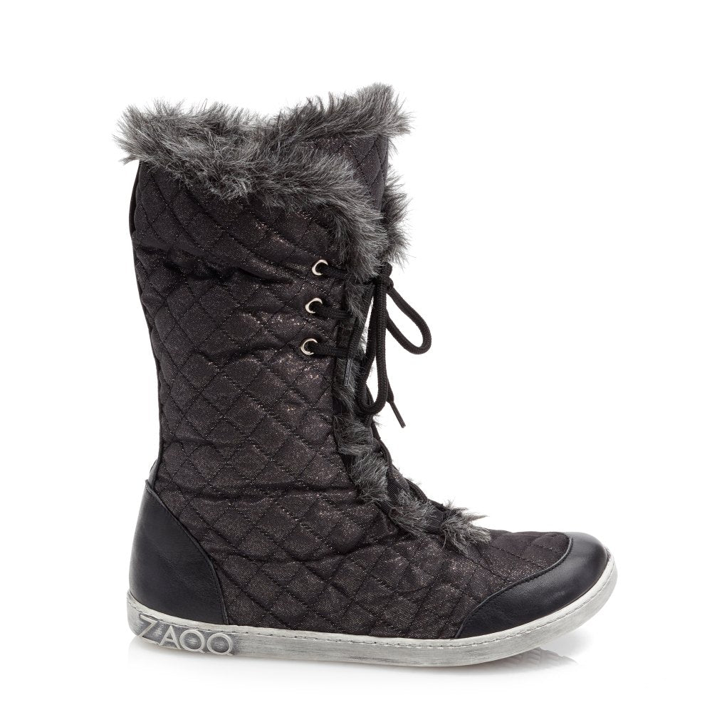 The QASEMIRO Winter Glare from ZAQQ features a sleek black quilted design with faux fur trim, elegant lace-up fastening, a flat sole and metallic branding to the side.