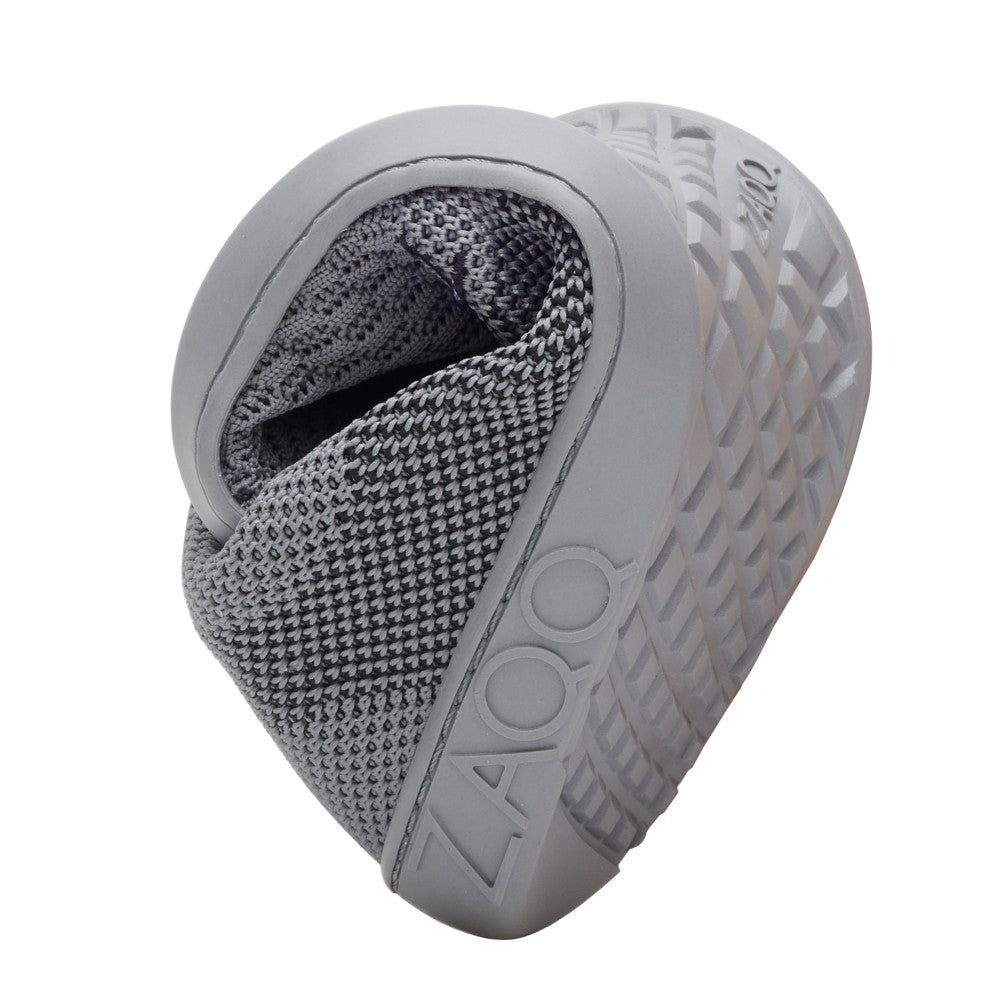 Introducing the QNIT Gray from ZAQQ, an elegant and modern sneaker with a textured gray upper and innovative, thick sole design. Expertly crafted as a barefoot shoe, this shoe is made from breathable cotton knit fabric for comfort. The embossed ZAQQ-Branding on the side gives the shoe a special touch, while the sole features a striking geometric pattern.