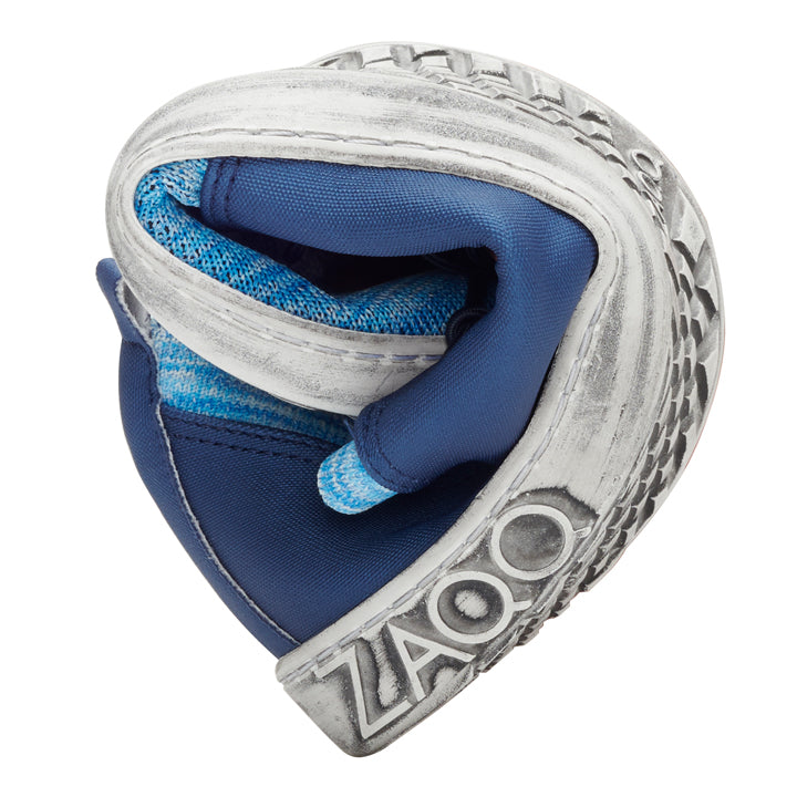 The one from ZAQQ The QRIS Blue barefoot shoe is curved to demonstrate its remarkable flexibility and unparalleled comfort. It features a blue and gray color scheme and a patterned sole that improves breathability. The ZAOO branding is clearly embossed on the sole.