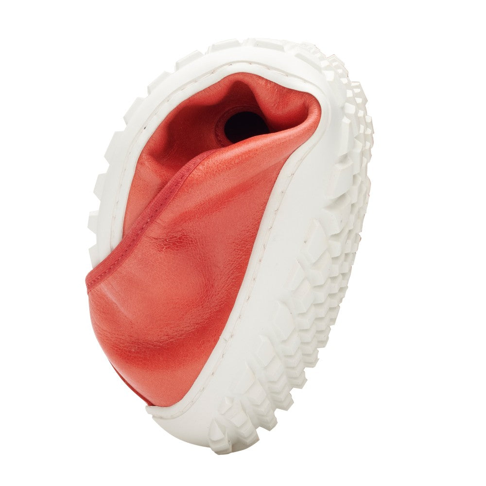 A unique sculpture inspired by the SUQAR Red by ZAQQ, which features a wavy sneaker design with a red nappa leather interior and a textured white sole, standing upright against a simple white background.