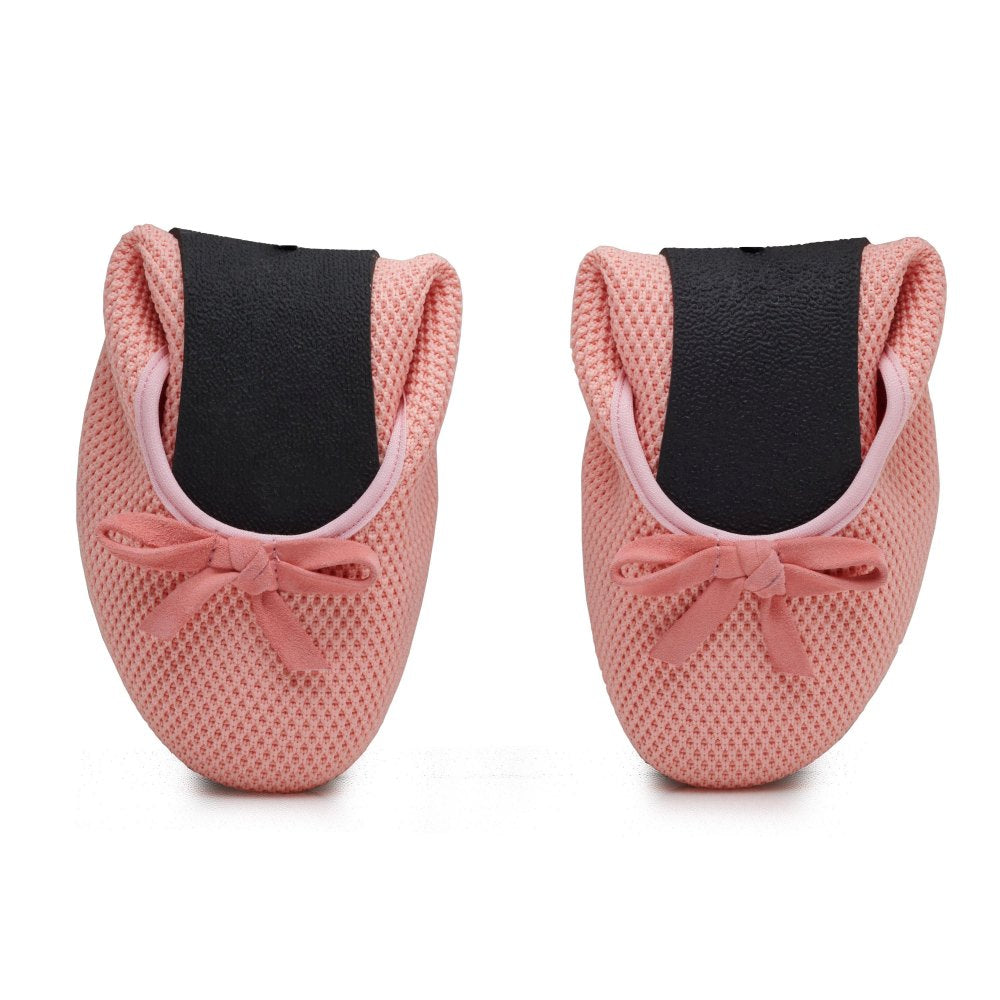 On a white background are two pink baby shoes from the TWIST Pink collection ZAQQ shown next to each other. The shoes have small bows on the top, a mesh structure and a black sole made of robust rubber.