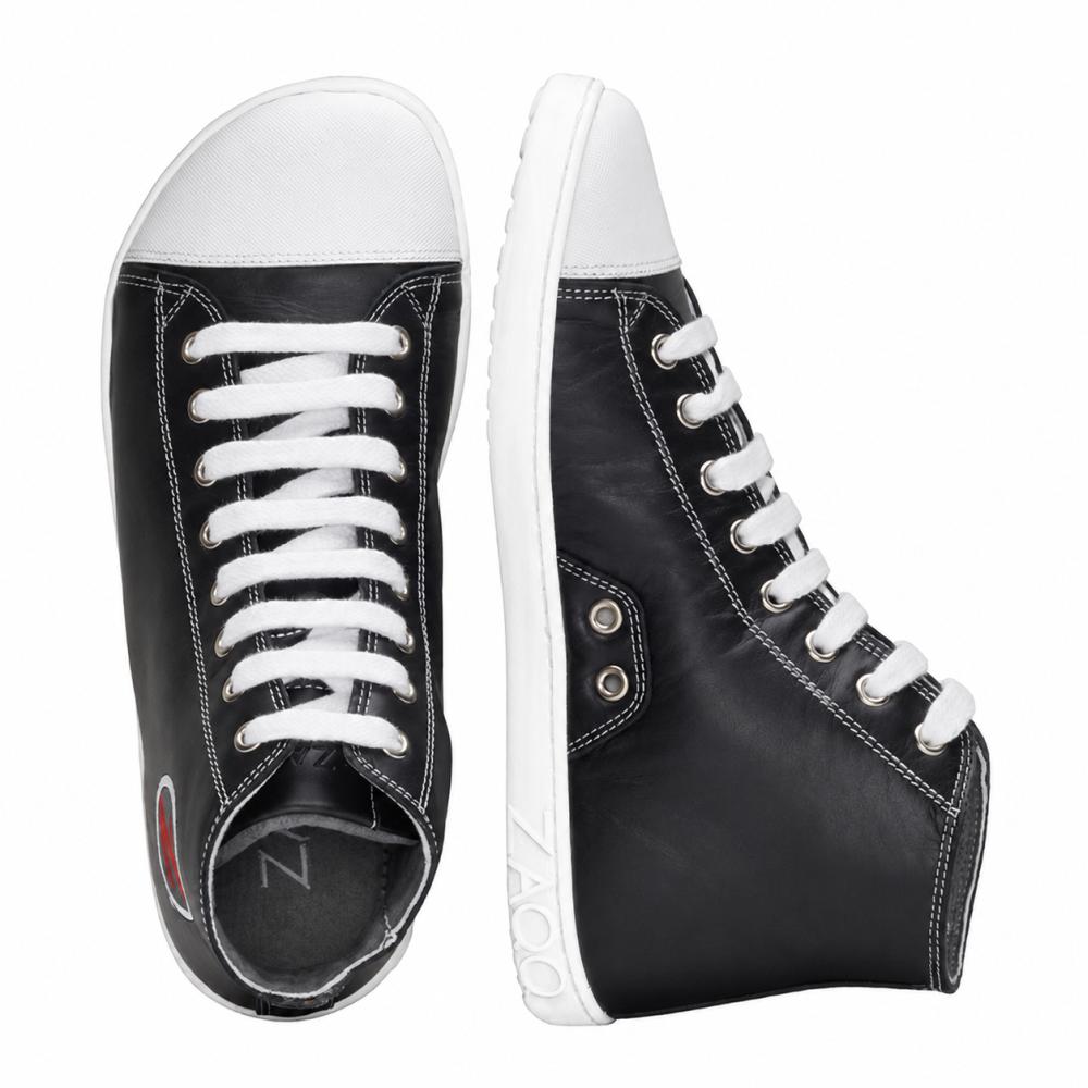 A pair of stylish black high-top sneakers from ZAQQ CHUQQS with a white rubber sole and laces. The left shoe stands upright, while the right shoe lies on its side, showcasing a chic logo near the heel.