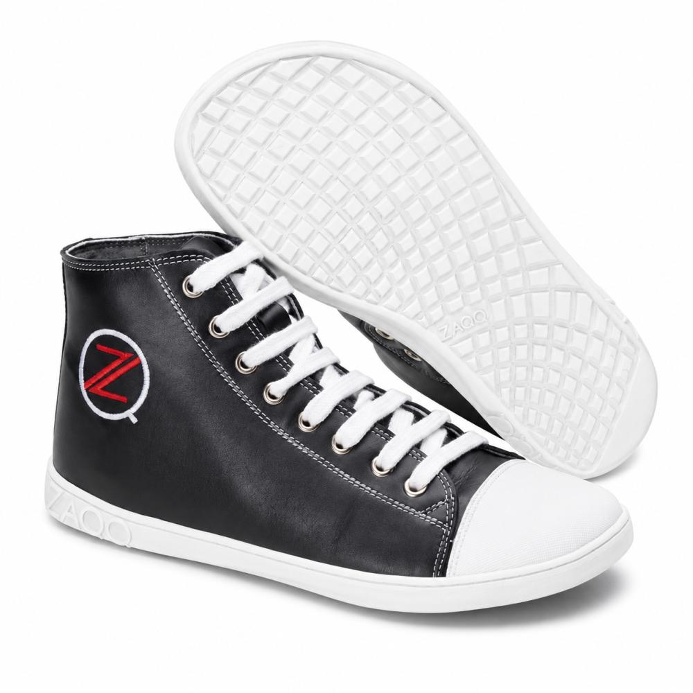 The CHUQQS Black High-Top Sneakers from ZAQQ have white soles and laces, reinforced by a white toe cap. A logo with a red Z in a white circle is visible on the side. The rubber sole is designed with a grid pattern for enhanced grip and durability.