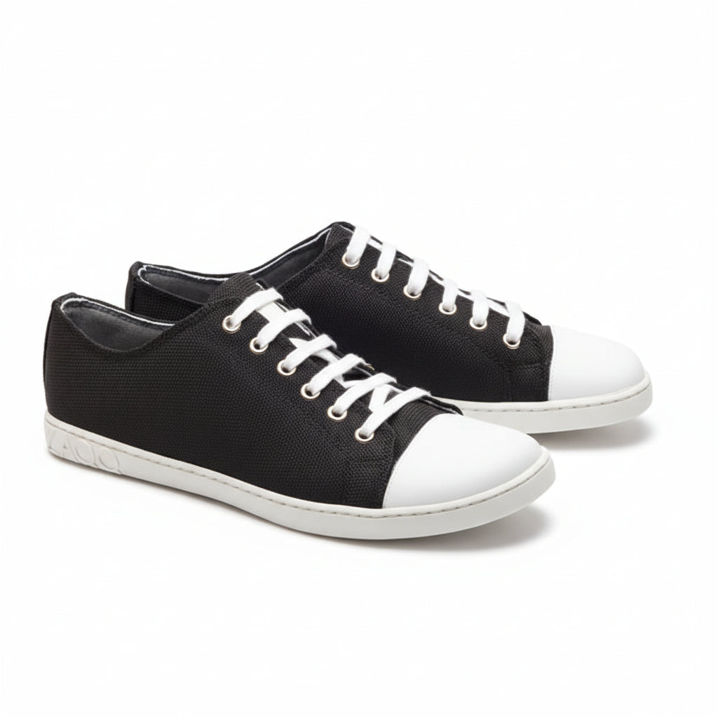 black retro sneaker made of textile with white laces and white toe cap