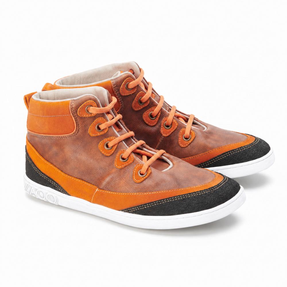 These ZAQQ CINQO Orange High-Top Sneakers captivate with orange and brown leather paired with vibrant orange laces, complemented by bright white soles. The decorative black patches accentuate the toe caps and heels, making them a stylish must-have.