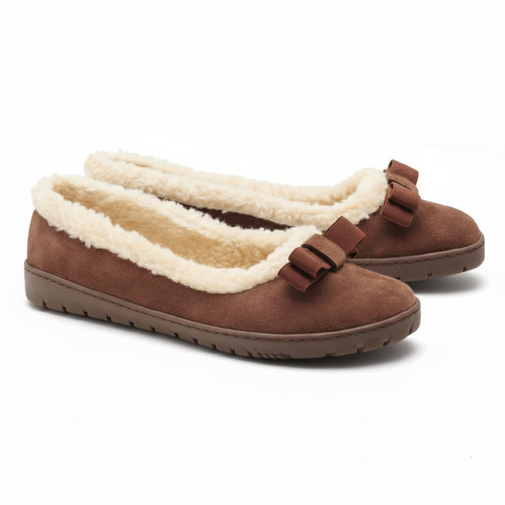 The DAQIN Winter Brown from ZAQQ has a plush cream lining and decorative bows on the top. These suede loafers feature a flat, suede-like texture and a slip-resistant rubber sole for reliable grip.