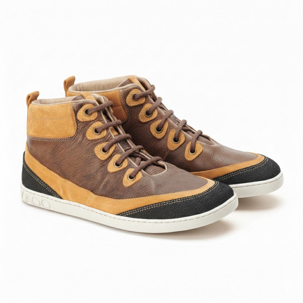 Introducing the FRANQY Brown from ZAQQ: These stylish high-top sneakers feature brown leather and tan suede accents. Finished with dark laces, black textured toe caps and white rubber soles, they create a rugged yet casual look and ensure supreme comfort with every step.
