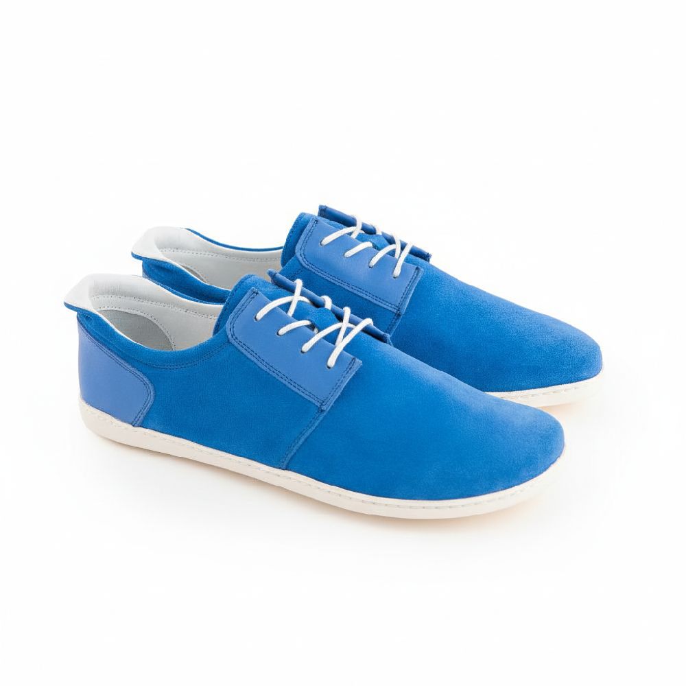 Modern blue sneaker barefoot shoes made of suede for men and women with white laces and white, flexible sole, wide toe box