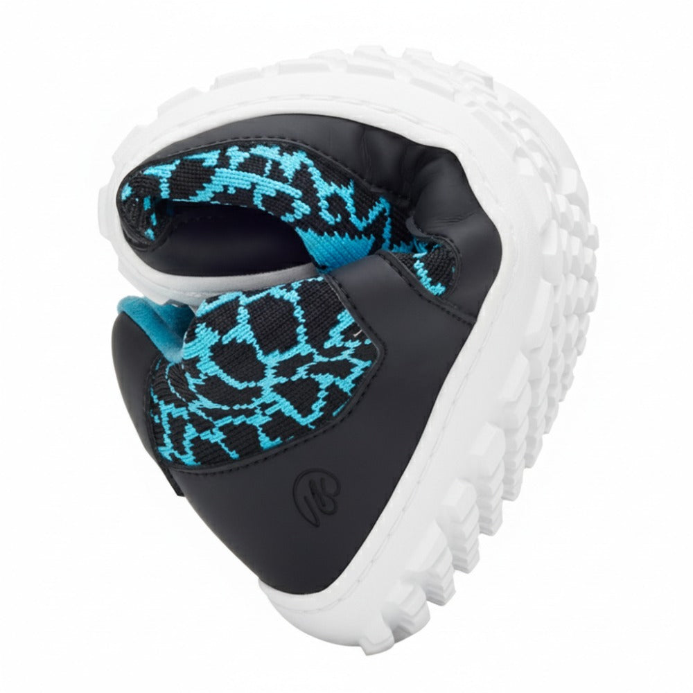 The QINGSTON Turquoise, an eye-catching chunky sneaker from ZAQQ, has a unique heart-shaped design. Made from vegan-friendly fabric with a turquoise pattern and complemented by a thick, textured white sole, it seamlessly combines style and sustainability.