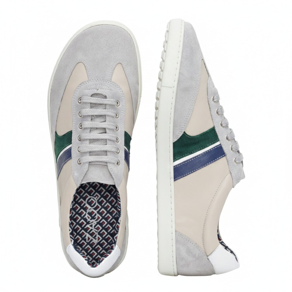 Introducing the QLAUDE Gray Sneakers from ZAQQ with a trendy design in a neutral color scheme with green and blue side stripes. Shown from the side and top, these sneakers reveal a patterned insole that gives them even more appeal. The structured details of the ZAQQ Sneaker sole adds an extra touch of style.