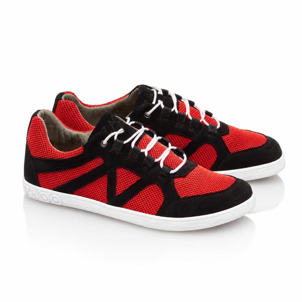 A pair of QUSQO Red Sneakers from ZAQQ featuring a combination of red mesh inserts and black suede accents, complete with white laces and a white sole. These running shoes boast a unique wave-shaped stitching design on the side and the brand name elegantly placed on the heel.