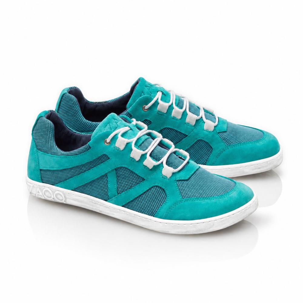 We present the QUSQO Turquoise by ZAQQ: These turquoise sneakers with white laces and gray soles offer a mesh and suede-like texture. With their modern design and graphic patterns on the sides against a white background, they ensure a 'breathable' experience and ultimate comfort.