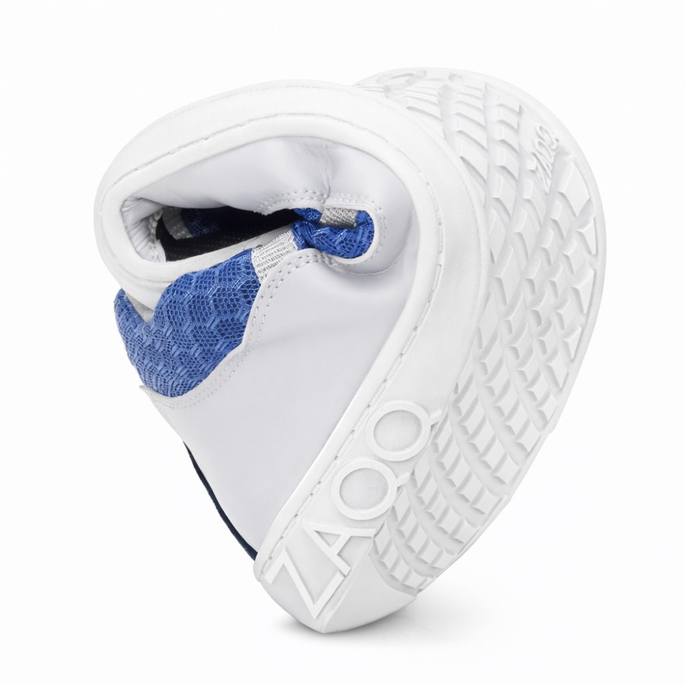 The SQOTT Blue sneaker from ZAQQ Can be folded in half to show its flexibility. Its sole with a grid pattern bears the brand name ZAQQ prominently displayed. The shoe's breathable design ensures comfort with every step.